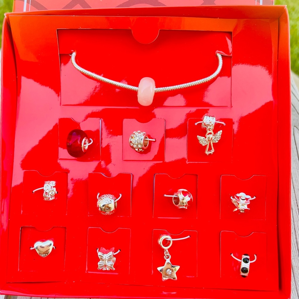 Avon Charm Bracelet with 12 Charms NWT Adjustable length bracelet